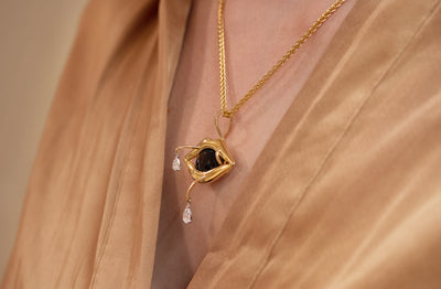 A Moment on the Lips: Sapphire and Diamond Pendant in Yellow Gold