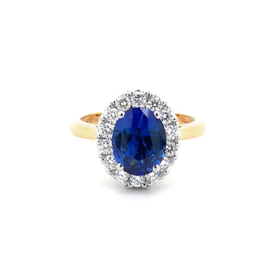 Midnight Bloom: Sapphire and Diamond Halo Ring in Yellow Gold | 2.55ct