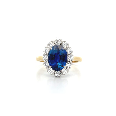 Blue Sapphire and Diamond Halo Ring in Yellow Gold | 4.40ctw
