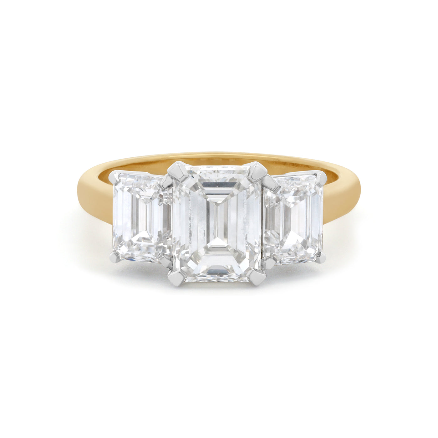 Erté: Emerald Cut Diamond Three Stone Ring