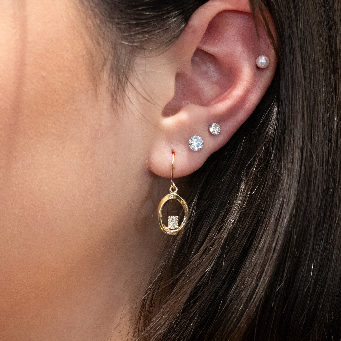 Mobius Twist Oval Cut Diamond Drop Earrings in Yellow Gold | 0.36ctw