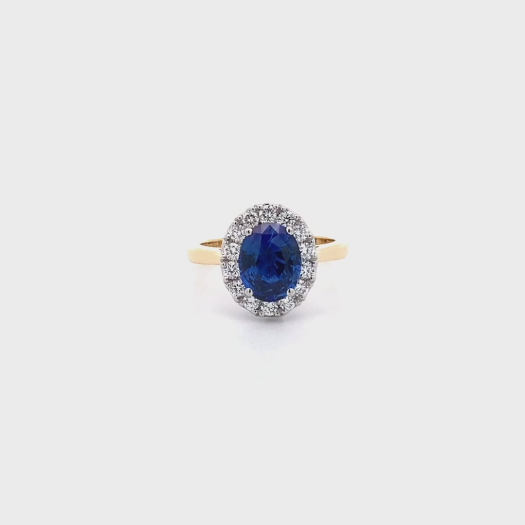 Midnight Bloom: Sapphire and Diamond Halo Ring in Yellow Gold | 2.55ct