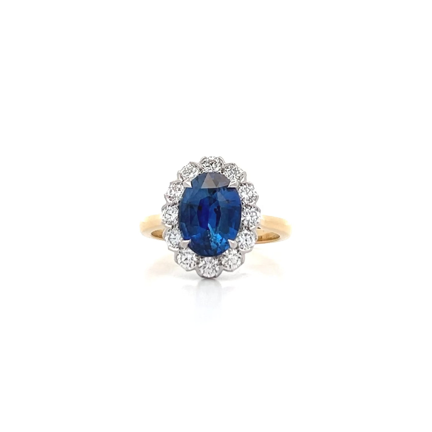 Rhapsody: Blue Sapphire and Diamond Halo Ring in Yellow Gold | 4.40ctw