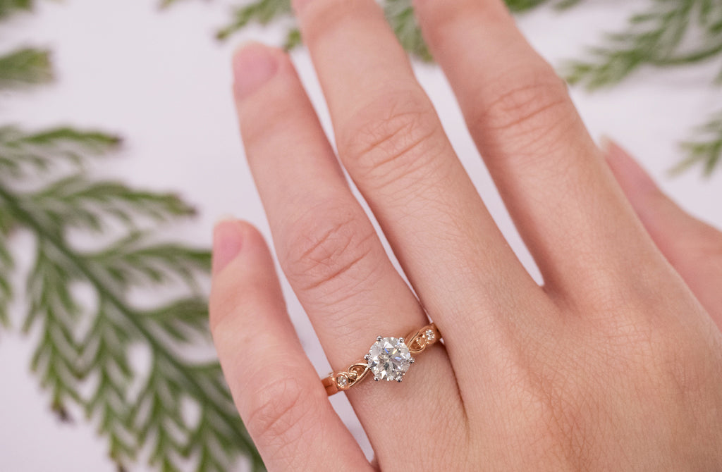 Diamond Solitaire, Diamond Engagement Ring, Narrative Collection, round brilliant cut diamond, 18K rose gold, 18ct, platinum setting, Maori, Polynesian, Celtic, solitaire engagement ring, ring design, side stones, koru details, jewelry, jewellery, ring on hand, ring size, ring on hand