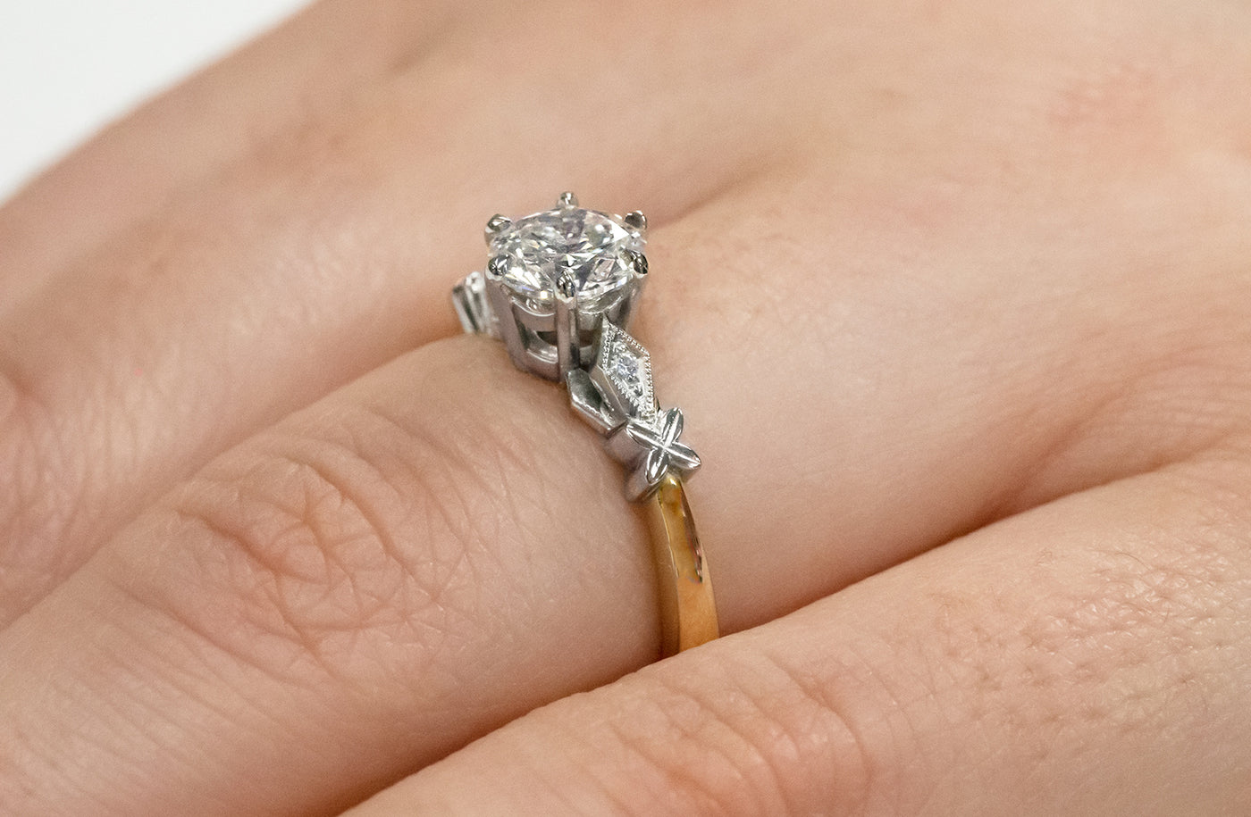 celtic inspired, diamond solitaire engagement ring, 18k, 18ct yellow gold, platinum setting, jewellery, jewelry, narrative collection, ring design, specialist, millgrain edge, deco style shoulders , ring on hand